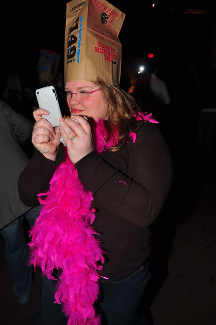 Katherine the Webmistress with feather boa and bag on head